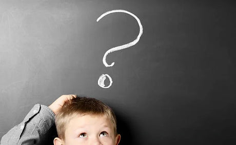 image of a child scratching his head and looking confused with a question mark above his head